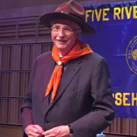 Jim Flaws dons the traditional Boy Scouts hat and scarf