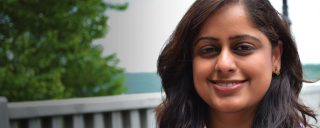 Closeup of Anusha, a Corning intern, with tree in background